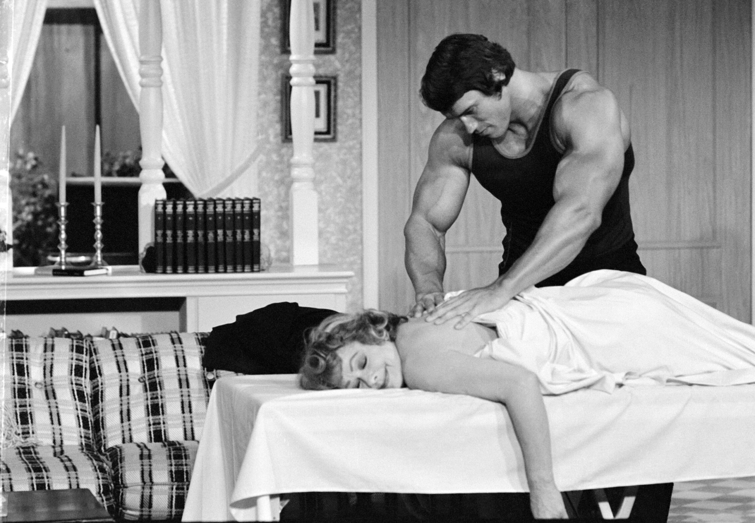 Arnold Schwarzenegger giving a massage